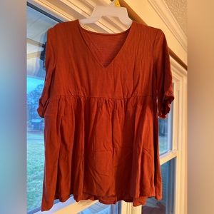Boutique top nwt. Burnt orange color. Size small.